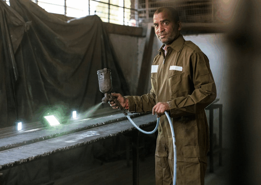 a professional working with polyurethane adhesive spray