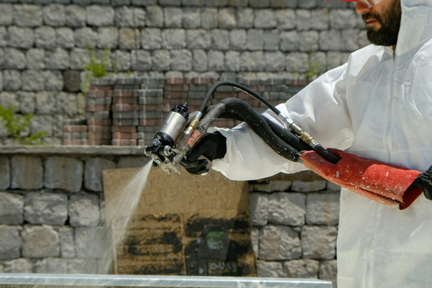a closeup shot of a professional using WPU adhesive spray