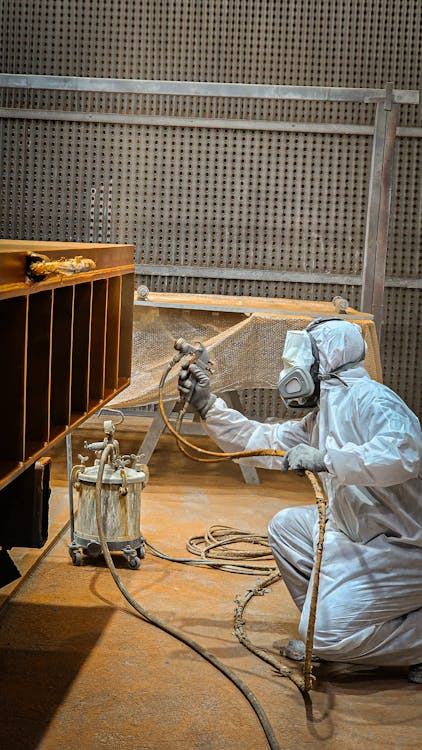 a professional hard at work coating a surface with WPU