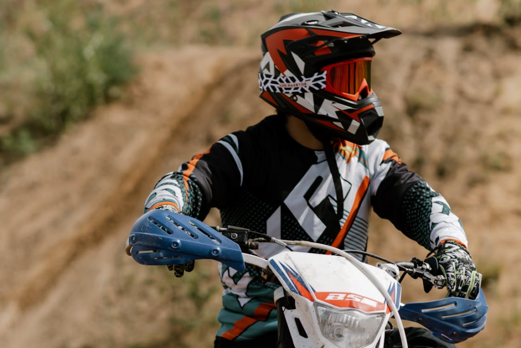 A dirt biker wearing a helmet