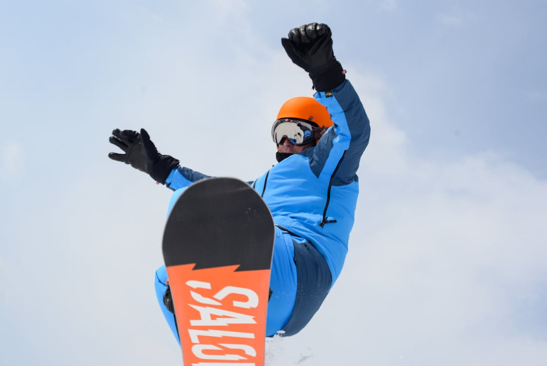 A snowboarder wearing protective gear