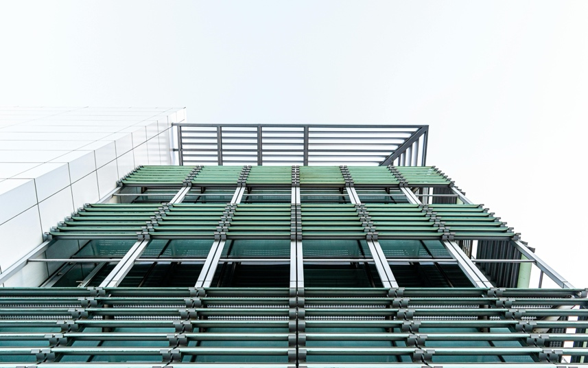 Modern building exterior treated with climate-resilient WPU protective coating