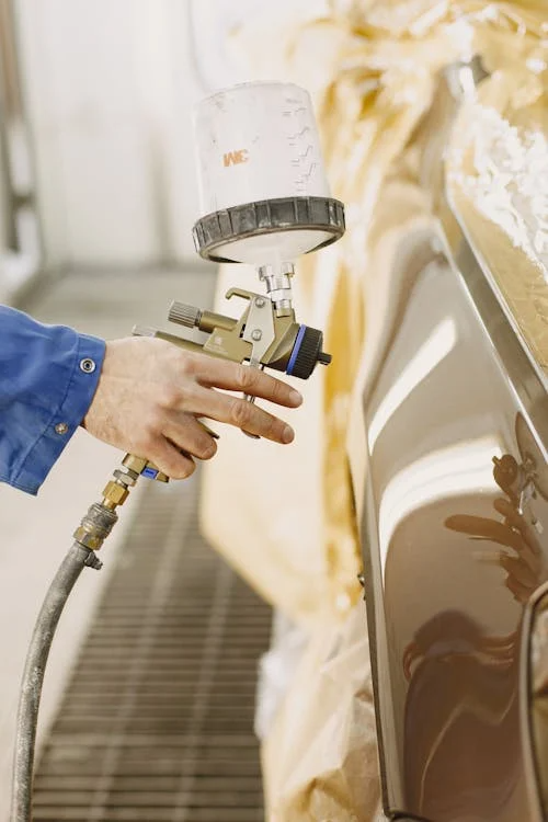 A person coating a surface with WPUs