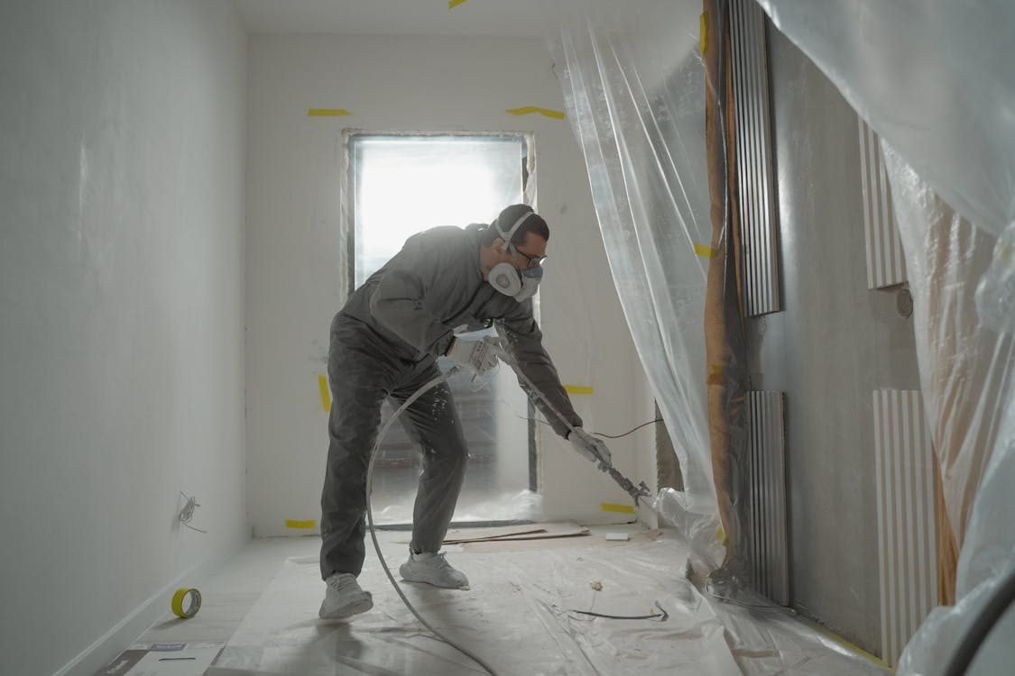 A person spraying a surface with WPUs