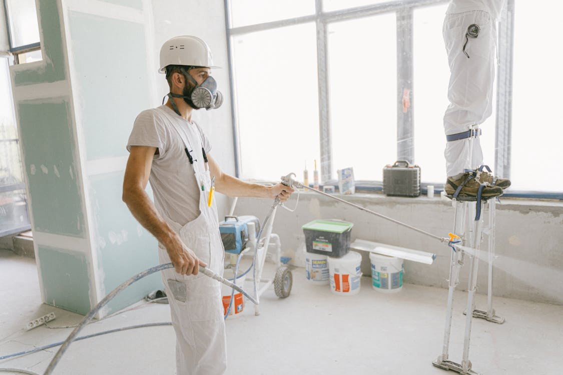 A person spraying a surface with WPUs